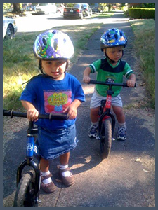 Toddler twins on balance bikes