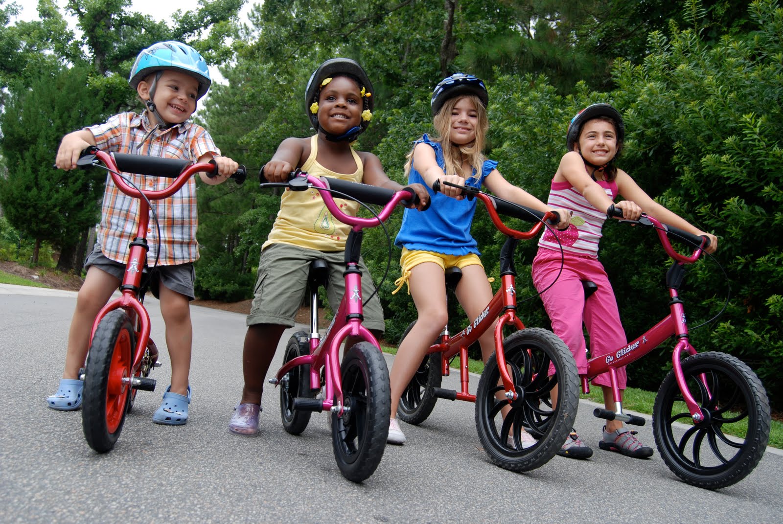 kids riding balance bikes